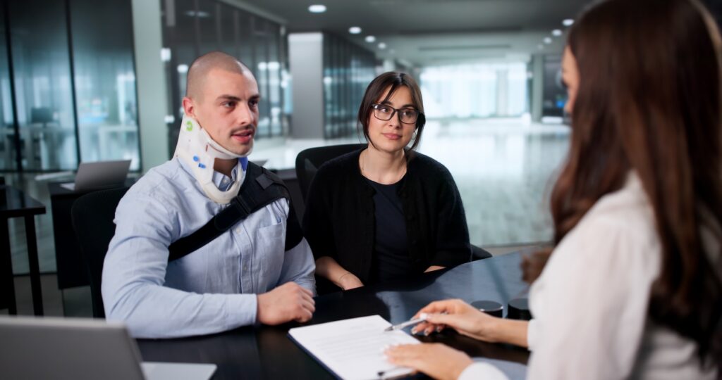 Happy worker smiles after receiving injury claim settlement from personal injury lawyer.