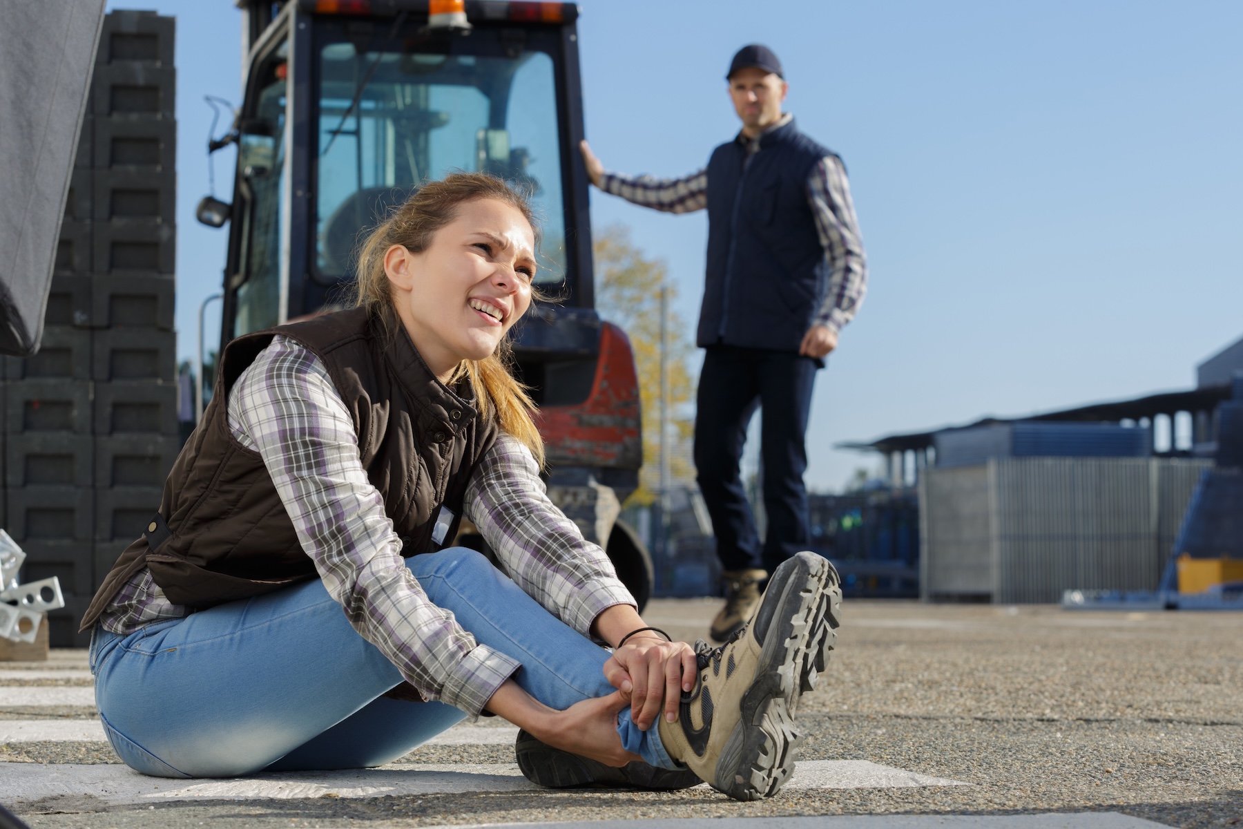Woman with hurt ankle in a workplace accident